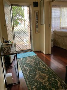 a living room with a large sliding glass door at Do Drop Inn 188 Clarke St east, CAREY PARK W A in Carey Park