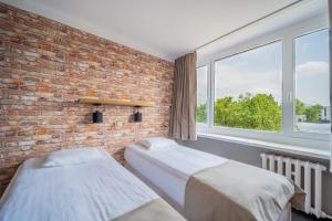 Posteľ alebo postele v izbe v ubytovaní Hotel Mazowiecki Łódź