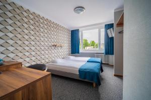 Posteľ alebo postele v izbe v ubytovaní Hotel Mazowiecki Łódź