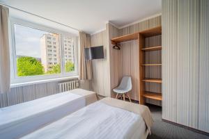 Posteľ alebo postele v izbe v ubytovaní Hotel Mazowiecki Łódź