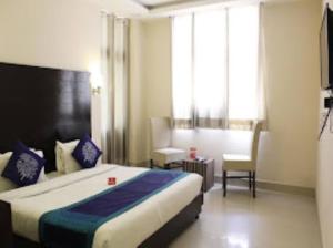 Hotel Gangotri Haridwar tesisinde bir odada yatak veya yataklar