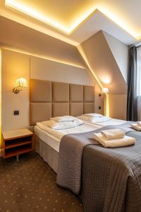 Postel nebo postele na pokoji v ubytování Hotel Galicja Wellness & SPA