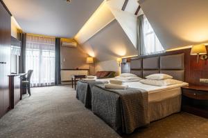 Postel nebo postele na pokoji v ubytování Hotel Galicja Wellness & SPA