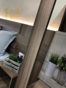 a room with a bed and some potted plants at Ronda By Lixloft en el Centro Histórico y Cerca de la Plaza Mayor in Salamanca