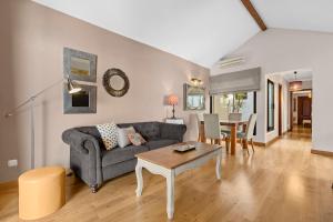 a living room with a couch and a table at Lanzarote Villa Aira in Playa Honda