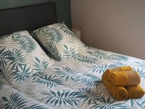 a unmade bed with a stuffed animal on it at #Villa LeCalmeDuVerdier - Spatieuse et Lumineuse in Tudeils