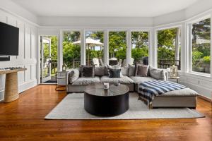 a living room with a couch and a table at Montecito Hamptons Style Gated Resort - Steps from the Beach in Montecito