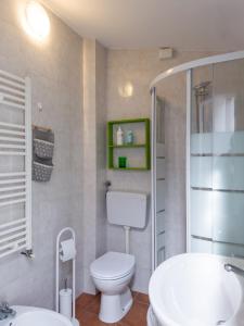 a bathroom with a toilet and a sink at Host4All casa vacanze in Falconara Marittima