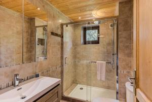 a bathroom with a shower and a sink and a toilet at Apartment Cry - Alpes Travel - Central Chamonix (sleeps 2-4) in Chamonix-Mont-Blanc
