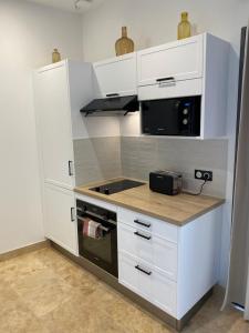Kuchnia lub aneks kuchenny w obiekcie Les Logis de Cocagne