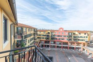 a balcony with a view of a parking lot with buildings at 1BD Apt w City view in the Little Italy in Sydney