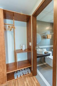 a bathroom with a sink and a mirror at Sapa Yen Hotel in Sa Pa