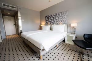 Voodi või voodid majutusasutuse Radisson Blu Conference Hotel, Düsseldorf toas