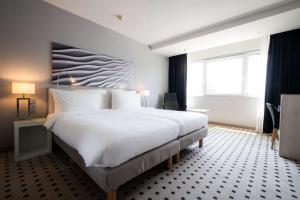 Voodi või voodid majutusasutuse Radisson Blu Conference Hotel, Düsseldorf toas