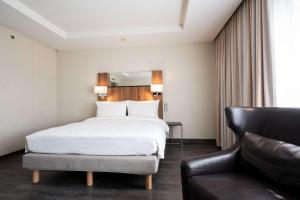 Voodi või voodid majutusasutuse Radisson Blu Conference Hotel, Düsseldorf toas