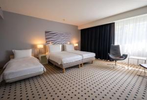 Voodi või voodid majutusasutuse Radisson Blu Conference Hotel, Düsseldorf toas