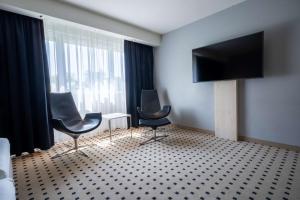 Televiisor ja/või meelelahutuskeskus majutusasutuses Radisson Blu Conference Hotel, Düsseldorf
