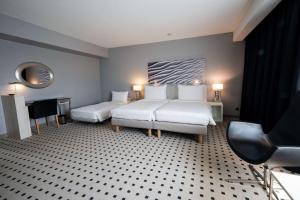 Voodi või voodid majutusasutuse Radisson Blu Conference Hotel, Düsseldorf toas