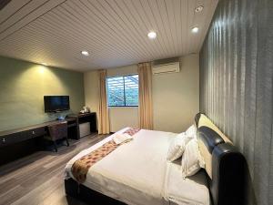 Postel nebo postele na pokoji v ubytování I Garden Hotel