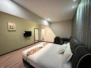 Postel nebo postele na pokoji v ubytování I Garden Hotel
