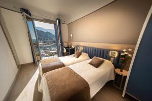 Кровать или кровати в номере Hotel Le Golfe