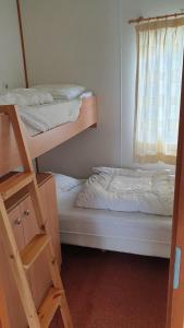 Ένα ή περισσότερα κρεβάτια σε δωμάτιο στο Chalet 128 Krabbenkreek