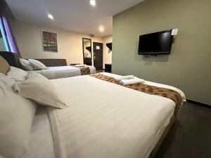 Postel nebo postele na pokoji v ubytování I Garden Hotel