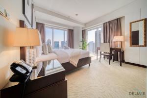 Postel nebo postele na pokoji v ubytování Premium 1BR at The Address Residences Dubai Marina by Deluxe Holiday Homes + 34 fotografií