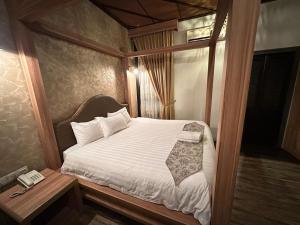 Postel nebo postele na pokoji v ubytování I Garden Hotel