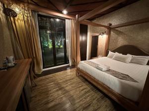 Postel nebo postele na pokoji v ubytování I Garden Hotel