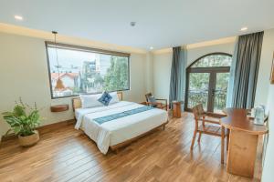 Postel nebo postele na pokoji v ubytování Sapa Yen Hotel