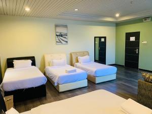 Postel nebo postele na pokoji v ubytování I Garden Hotel