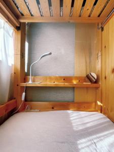 Ein Bett oder Betten in einem Zimmer der Unterkunft 海に恋する泊まれる喫茶店 ポパイ