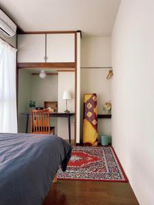 Ein Bett oder Betten in einem Zimmer der Unterkunft 海に恋する泊まれる喫茶店 ポパイ