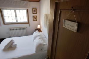 Posteľ alebo postele v izbe v ubytovaní Apartamento turístico "A Fonte Dos Xudíos"
