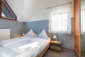 Postel nebo postele na pokoji v ubytování Sonnendeck 1