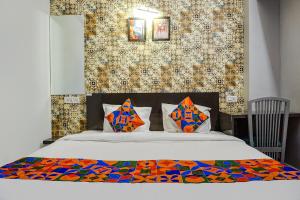 Postel nebo postele na pokoji v ubytování FabHotel Tan Square - Nr Eon IT Park