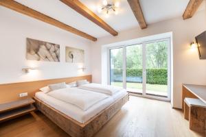 Łóżko lub łóżka w pokoju w obiekcie Residenz zur Hackenschmiede