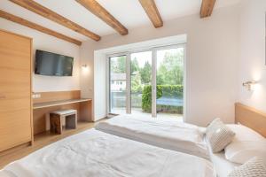 Łóżko lub łóżka w pokoju w obiekcie Residenz zur Hackenschmiede