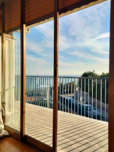 a balcony with a view of the ocean at SeaSide in Giardini Naxos