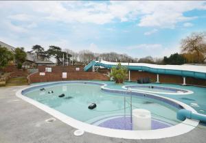 a large swimming pool in a parking lot at KINSGATE 2 in Shanklin