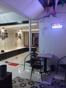 a room with a table and chairs in a store at SP.Place Hotel Koh Chang in Ko Chang