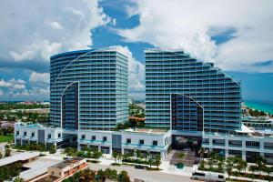 two tall glass buildings in a city with a street at W Fort Lauderdale in Fort Lauderdale