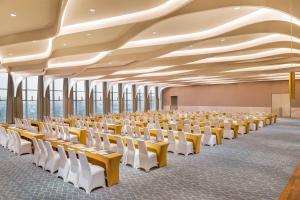 a large room with rows of tables and chairs at Le Meridien Shanghai Hongqiao,Minhang in Shanghai