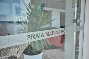 a door with a sign that reads praia marinah at Hotel Praia Marina by RIDAN Hotels in Praia da Vitória