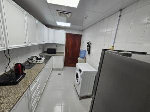 Kuchyň nebo kuchyňský kout v ubytování Oasis Hostel