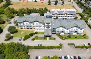 an aerial view of a building with a parking lot at Best Western Modena District in Campogalliano