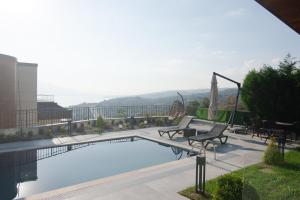 a swimming pool on the roof of a building at Jasmine Lodge Sapanca With Heated Pool in Serdivan
