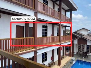 a view of a building with a balcony and a pool at Dz Residence Tunjong in Kota Bharu