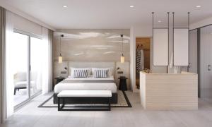 エス・フィゲラル・ビーチにあるインビサ ホテル クラブ カラ ブランカのベッドルーム(ベッド1台、テーブル付)